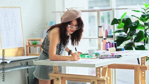 Designers or tailors are enjoying their work.