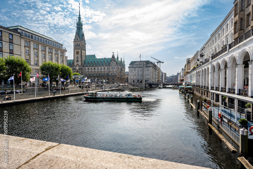 Canal with view of Hamburg town hall and Alsterarkaden in city center