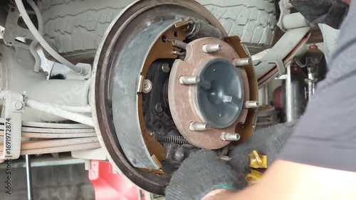 mechanic is repairing the car brakes