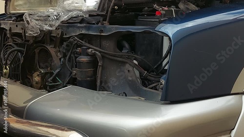 The mechanic is changing the car's headlights