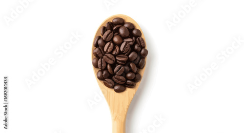 Roasted coffee beans piled high on a wooden spoon, isolated on white.