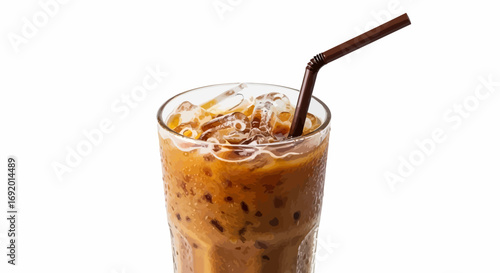 Iced coffee in a glass with ice cubes and a straw, refreshing summer drink.