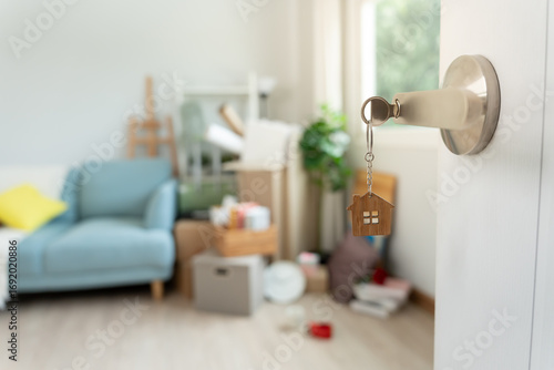 Wallpaper Mural Moving house, relocation. The key was inserted into the door of the new house, inside the room was a cardboard box containing personal belongings and furniture. move in the apartment or condominium Torontodigital.ca