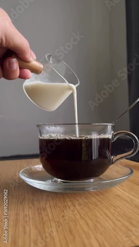 pouring tea into cup