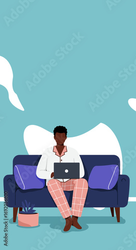 Relaxed man in pajamas works remotely from home on a laptop, embodying comfortable modern lifestyle and flexible work concepts.