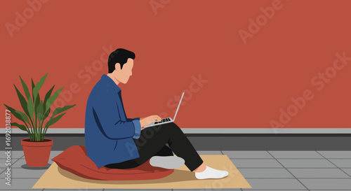 Young man works remotely on his laptop from the comfort of his home, sitting casually on the floor. Ideal for business, freelance, and modern lifestyle content.