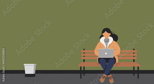 Woman in a warm coat sitting on a bench using a laptop. Represents modern remote work, digital lifestyle, or online learning.