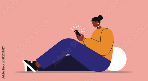 A casually dressed person sitting on the floor, deeply engaged with their glowing smartphone, symbolizing modern digital communication and leisure lifestyle.