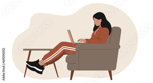 Young woman comfortably working from home on her laptop in an armchair. Depicts remote work, online learning, or freelance lifestyle, emphasizing flexibility and modern productivity.