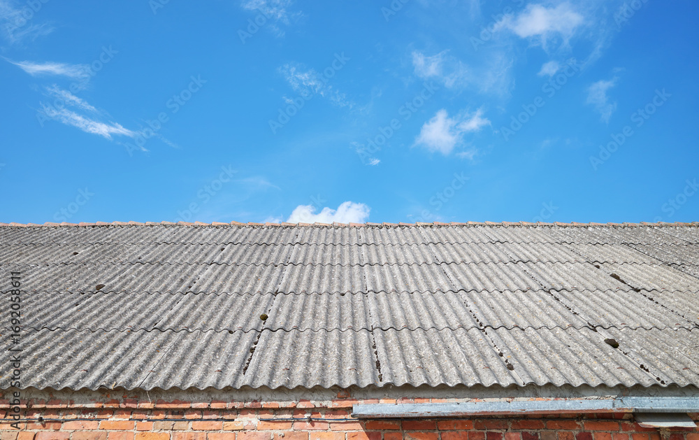 Naklejka premium Photo of a roof made of carcinogenic asbestos tiles.
