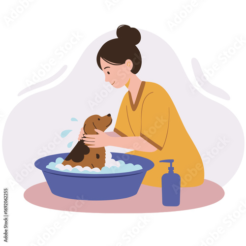 Woman washing dog in bath with bubbles and shampoo bottle nearby  