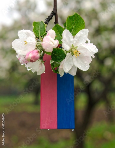 Pink and blue tag with blossoms