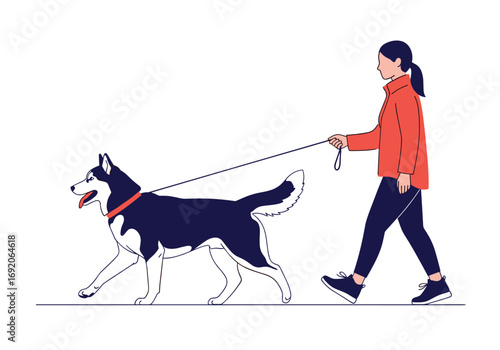 Woman walking her siberian husky dog on a leash outdoors