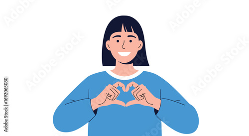 Young woman forms heart shape with hands showing affection and positive emotion