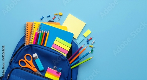 A vibrant bloom of colorful school supplies whisked from an open blue backpack, capturing the subtle essence of a new educational journey on a clean, minimalist backdrop