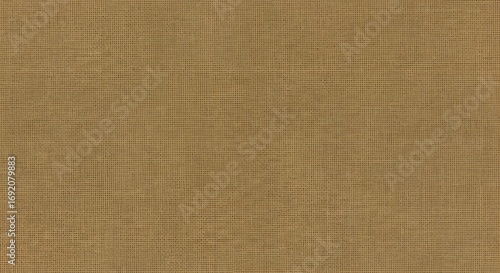 A close-up, full-frame view of a textured brown fabric with a subtle grid pattern.