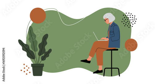 Elderly woman focused on her laptop, working remotely or learning online. Modern lifestyle and digital connectivity for seniors.