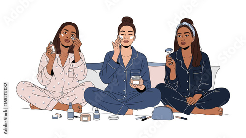 Three diverse young women in comfortable pajamas applying skincare products together during a relaxing at home spa night routine