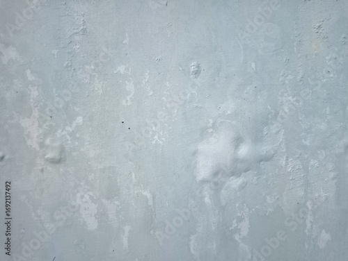 Damp and moldy wall. Peeling of paint and swelling of the wall from excessive moisture. Water is leaking out of the wall.