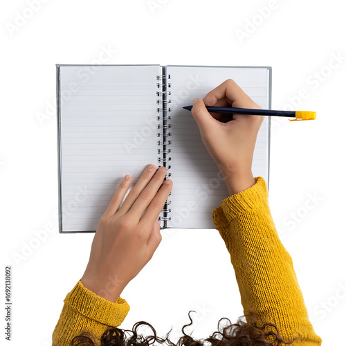 Person writing in notebook : Overhead view of a spiral notebook with lined pages hand holding a pen in the act of writing