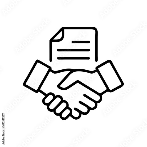 Hands shaking over a contract document representing agreement concept  