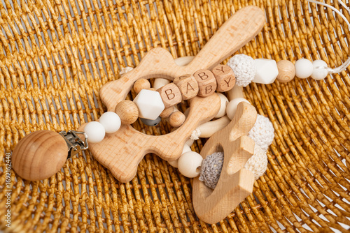 Natural wooden baby toys in a woven basket setting