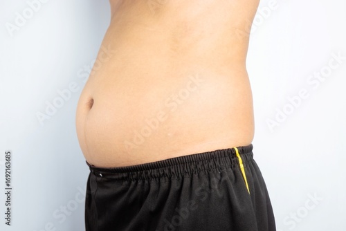 male showing of an overweight belly