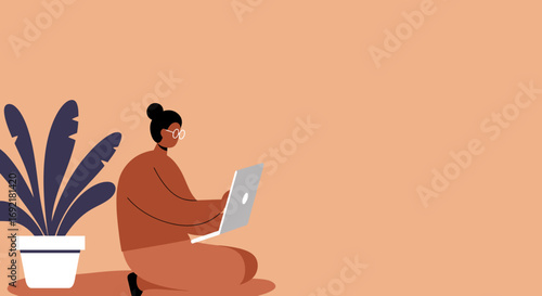 Young woman in glasses focused on her laptop, working remotely or studying from home in a relaxed, modern setting with a potted plant.