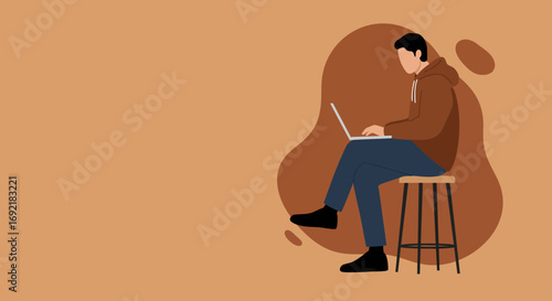 A person wearing casual clothes works diligently on a laptop while seated on a stool, representing modern remote work or online learning.