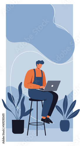 Focused man in overalls working remotely on a laptop, symbolizing freelance, online business, and digital lifestyle in a modern, plant-filled space.