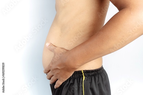 Man holding his fat belly