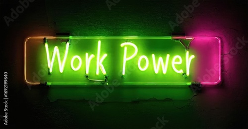 Bright neon sign displays Work Power. Pink frame surrounds green light, mounted on dark wall. Simple, bold message.