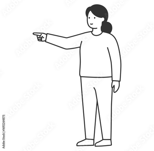 Woman in casual attire pointing her index finger towards an object with a smile