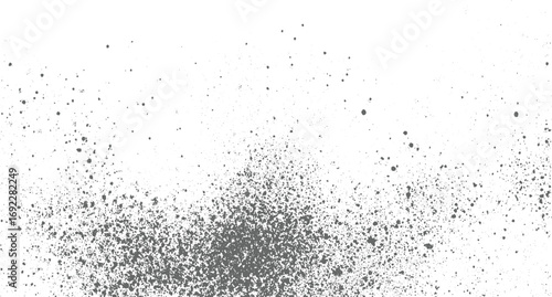 Gray speckles and dots of varying sizes are scattered across a white background creating a textured pattern.