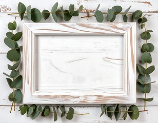 White frame with eucalyptus leaves