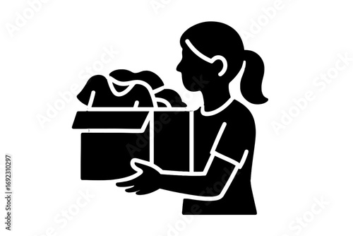 Black silhouette glyph icon of a person holding a cardboard box full of clothes for donation or charity on an isolated white background
