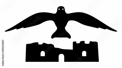 Silhouette of a bird with outstretched wings flying above a ruined castle in black and white style