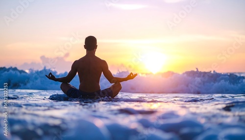Silhouette of man meditating on a beach at sunset