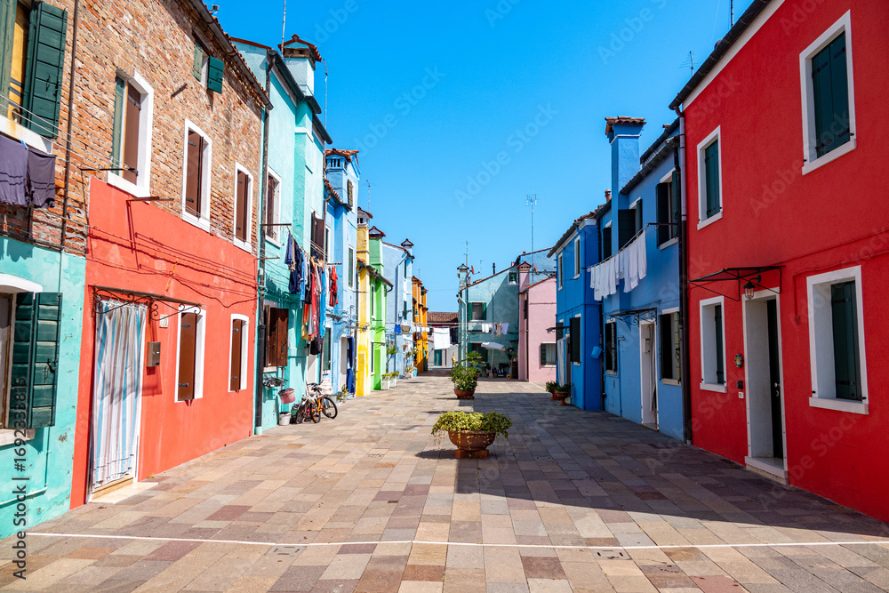 Obraz premium Colorful houses in a canal street houses of Burano island, Venice, Italy