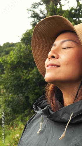 Relaxed Female Traveler Face Close Up Enjoying Fresh Air and Sense of Freedom Outdoors, Northern Thailand