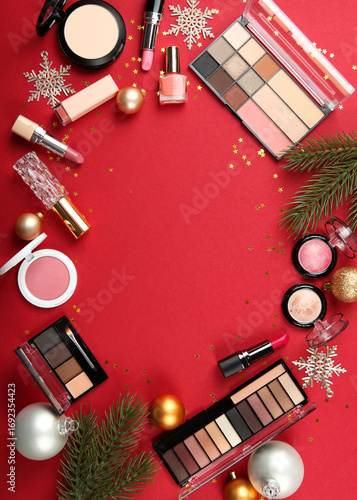 Beautiful composition with Christmas decor and makeup cosmetics top view.mother and daughter on a festive New Year background

