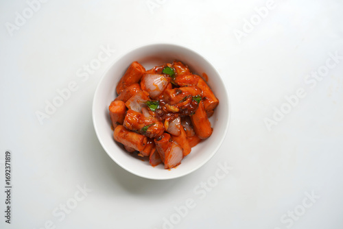 Hot and Spicy Devil Sausage Dish in White Bowl.
