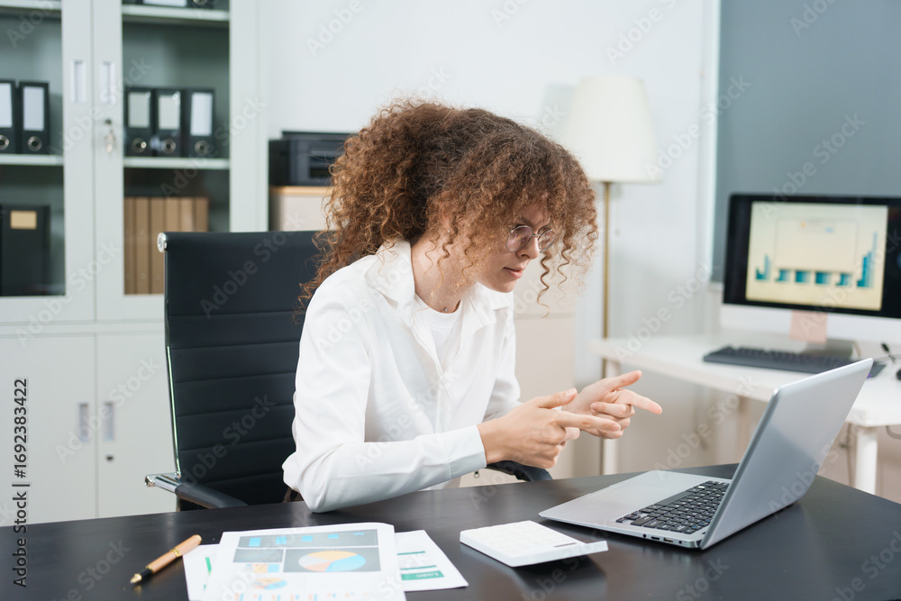 Tired young woman working late at the office, looking sleepy, using smartphone, wanting to relax, working overtime, concept of overtime deadline. Tired young woman working late at the office, looking sleepy, using smartphone, wanting to relax, working overtime, concept of overtime deadline.
