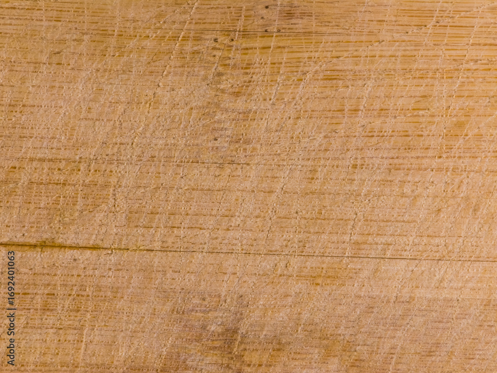 Fototapeta premium Close up wooden surface with natural grain and scratches texture