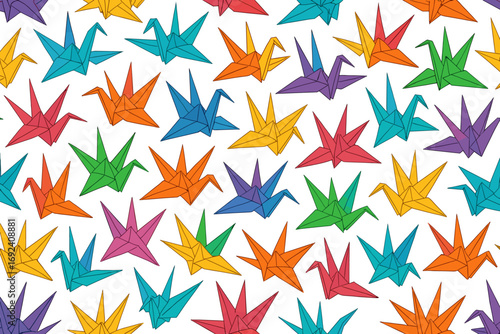 Colorful origami cranes and stars arranged in an artistic pattern on a white background