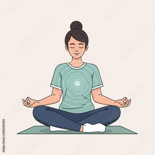 Person meditating cross-legged on a mat.