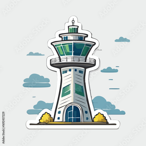 White lighthouse tower stands on the rocky coast under a blue sky, overlooking the vast ocean