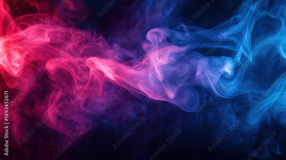 Fototapeta premium A vibrant display of colorful smoke swirls in shades of pink and blue against a dark background, creating a mystical and ethereal atmosphere.