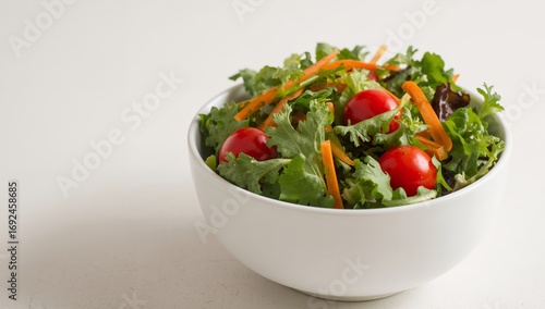 A Simple Arrangement of Greens, Reds, and Oranges in a White Bowl, Front View.