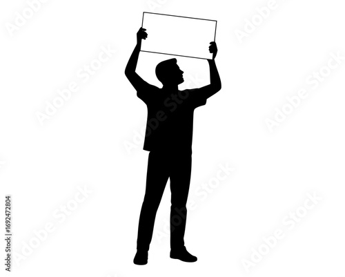 Silhouette of a man holding a blank sign above his head in a protest or demonstration scene view
